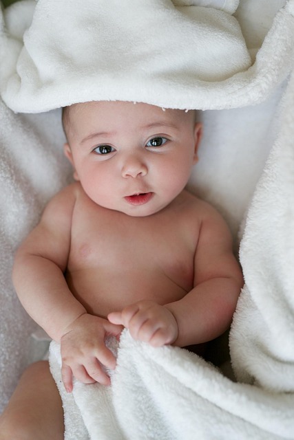 infant looking in camera with blue eyes