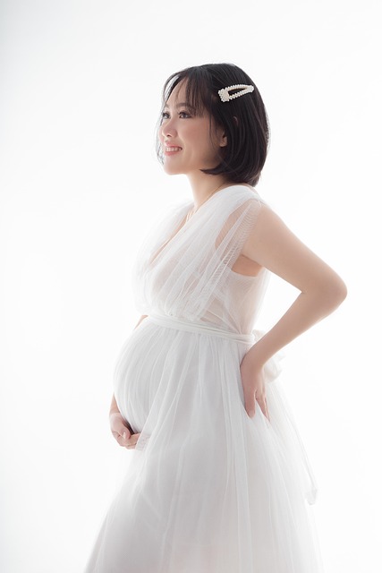 pregnant woman in white dress