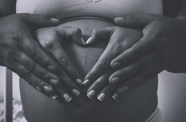 pregnant woman with hands on belly